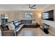 Living room with sectional sofa and large TV at 12716 Hampton Hill Dr, Riverview, FL 33578