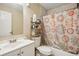 This bathroom features a sink, toilet, and shower with a decorative curtain at 3156 Depew Ave, Port Charlotte, FL 33952