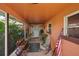 Cozy front porch featuring seating and plants with a colorful rug at 3156 Depew Ave, Port Charlotte, FL 33952