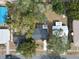 Aerial view of home, lawn, and mature trees at 5824 11Th St, Zephyrhills, FL 33542
