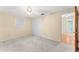 Bright bedroom with new carpet, ceiling fan, and a closet providing ample storage space at 5824 11Th St, Zephyrhills, FL 33542
