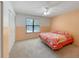 Bedroom with a double bed, ceiling fan, and large closet at 1529 Highland Ridge Cir # 1529, Brandon, FL 33510