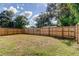 Fenced backyard with grassy area at 2409 S 70Th St, Tampa, FL 33619