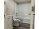 Clean bathroom with a tub, toilet and vanity at 2409 S 70Th St, Tampa, FL 33619