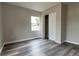 Bedroom with vinyl flooring, closet, and window at 2409 S 70Th St, Tampa, FL 33619