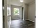 Well-lit bedroom with wood-look floors and a closet at 2409 S 70Th St, Tampa, FL 33619