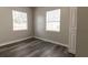 Bedroom with vinyl flooring and two windows at 2409 S 70Th St, Tampa, FL 33619