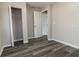 Spacious bedroom featuring wood-look floors and ample closet space at 2409 S 70Th St, Tampa, FL 33619