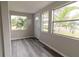 Light and airy entryway featuring wood-look floors and a view to the exterior at 2409 S 70Th St, Tampa, FL 33619