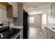 Modern kitchen with stainless steel appliances and gray cabinets at 2409 S 70Th St, Tampa, FL 33619