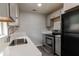 Updated kitchen featuring stainless steel appliances and quartz countertops at 2409 S 70Th St, Tampa, FL 33619