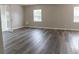 Living room showcasing a large area with wood-look floors at 2409 S 70Th St, Tampa, FL 33619