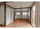 Bright living room with wood-look floors and sliding glass doors at 2409 S 70Th St, Tampa, FL 33619