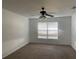 Bedroom featuring carpet, white walls, and a ceiling fan at 423 Chimney Rock Dr, Ruskin, FL 33570