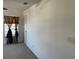 Bare bedroom featuring carpet flooring, a window with patterned curtains, and white walls at 423 Chimney Rock Dr, Ruskin, FL 33570