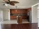 Open kitchen with wooden cabinets, granite countertops, stainless steel appliances, and a tile backsplash at 423 Chimney Rock Dr, Ruskin, FL 33570