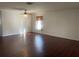 Spacious living room features hardwood floors, white walls, and natural light at 423 Chimney Rock Dr, Ruskin, FL 33570