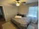 Spacious bedroom with king-size bed and ceiling fan at 809 Daphne Dr, Brandon, FL 33510