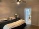 Bedroom with queen-size bed and en-suite bathroom at 809 Daphne Dr, Brandon, FL 33510