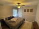 Bright bedroom with queen-size bed and ceiling fan at 809 Daphne Dr, Brandon, FL 33510