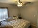 King-size bed in spacious bedroom with ceiling fan at 809 Daphne Dr, Brandon, FL 33510