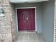 Double door entry with brick facade and tiled flooring at 809 Daphne Dr, Brandon, FL 33510