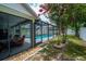 Relaxing pool area with screened enclosure and landscaping at 809 Daphne Dr, Brandon, FL 33510