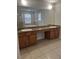 Bathroom vanity with double sinks and a large mirror at 13034 Avalon Crest Ct, Riverview, FL 33579