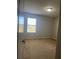 Carpeted bedroom with a large window providing natural light at 13034 Avalon Crest Ct, Riverview, FL 33579