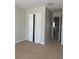 Bedroom with carpet and a closet with bi-fold doors at 13034 Avalon Crest Ct, Riverview, FL 33579