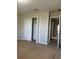 Bedroom featuring carpet, closet with folding doors, and neutral walls at 13034 Avalon Crest Ct, Riverview, FL 33579
