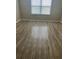 Bedroom featuring laminate flooring and a window with blinds at 13034 Avalon Crest Ct, Riverview, FL 33579