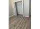 Spacious closet with ample storage, wood floors, and white trim for a clean, modern look at 13034 Avalon Crest Ct, Riverview, FL 33579