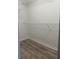 Walk-in closet featuring laminate flooring and metal shelving at 13034 Avalon Crest Ct, Riverview, FL 33579