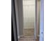 View of the closet featuring laminate flooring and metal shelving at 13034 Avalon Crest Ct, Riverview, FL 33579