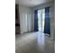 Dining area with tile flooring, patio access, and elegant black curtains for added style at 13034 Avalon Crest Ct, Riverview, FL 33579