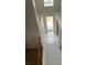 Bright foyer with tile flooring, arched doorway, and staircase to the second floor at 13034 Avalon Crest Ct, Riverview, FL 33579