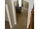 Looking through a foyer archway into the kitchen and living space at 13034 Avalon Crest Ct, Riverview, FL 33579