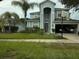 Attractive two-story home with a basketball hoop by the driveway and mature landscaping at 13034 Avalon Crest Ct, Riverview, FL 33579