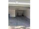 View of the garage showing a water heater and some miscellaneous items at 13034 Avalon Crest Ct, Riverview, FL 33579