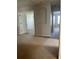 Second floor hallway with neutral carpet and multiple doors leading to bedrooms and bathrooms at 13034 Avalon Crest Ct, Riverview, FL 33579