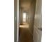 Second floor hallway with neutral carpet and doors leading to other rooms at 13034 Avalon Crest Ct, Riverview, FL 33579