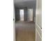Carpeted hallway with doorways leading to other areas of the house at 13034 Avalon Crest Ct, Riverview, FL 33579