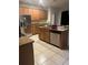 Spacious kitchen featuring stainless steel appliances, granite countertops, and wood cabinets at 13034 Avalon Crest Ct, Riverview, FL 33579