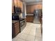 A kitchen with stainless steel appliances, granite countertops, and wooden cabinets at 13034 Avalon Crest Ct, Riverview, FL 33579