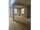 Open living space with tile and carpet floors, creating a welcoming and versatile area at 13034 Avalon Crest Ct, Riverview, FL 33579