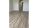Bright living room featuring wood-look flooring and neutral wall colors at 13034 Avalon Crest Ct, Riverview, FL 33579