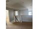 Open loft area with neutral carpet, staircase, and views of the foyer below at 13034 Avalon Crest Ct, Riverview, FL 33579