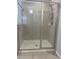 Shower with glass doors and tiled walls at 13034 Avalon Crest Ct, Riverview, FL 33579