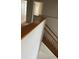 Wooden staircase with white walls leading to the upper level of the home at 13034 Avalon Crest Ct, Riverview, FL 33579